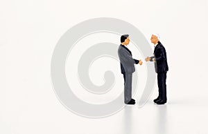 Businessmen miniatures agreeing