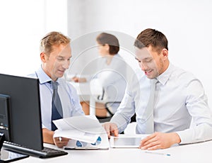 Businessmen with notebook and tablet pc