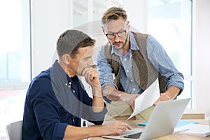 Businessmen at office working on a project