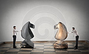 Businessmen playing chess