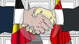 Businessmen or politicians shake hands against flags of Belgium and China. Official meeting or cooperation related