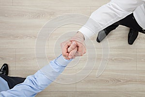 Businessmen's hands demonstrating a gesture of a strife or solid