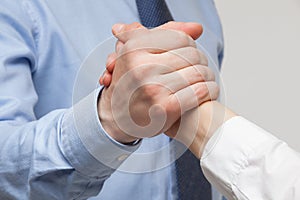 Businessmen's hands demonstrating a gesture of a strife or solid