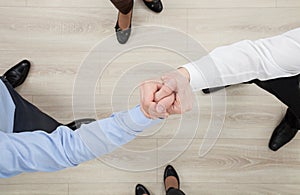 Businessmen's hands demonstrating a gesture of a strife or solid photo