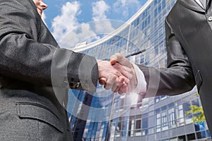 Businessmen shake hands