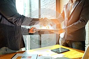 Businessmen shake hands when entering into business deal,In the