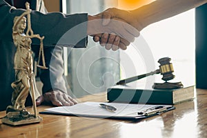 Businessmen shake hands with lawyers to seal a deal with a partner lawyer or a lawyer who is discussing a contract agreement. with