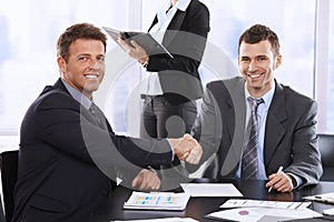Businessmen shaking hands photo