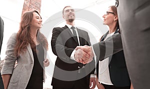 Businessmen shaking hands in conference room