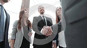 businessmen shaking hands in conference room