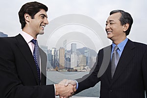 Businessmen Shaking Hands Outdoors