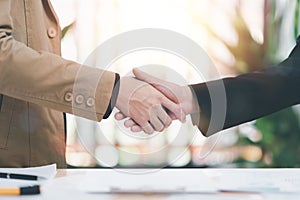Businessmen shaking hands to indicate a business deal,successful contract management of the company,signing an agreement,business