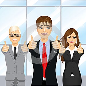 Businessmen showing thumbs up in an office