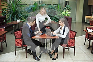 Businessmen sitting in cafe for a laptop