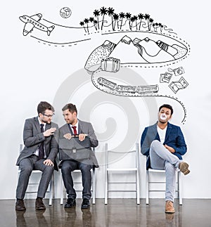 businessmen sitting on chairs