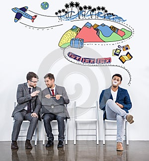 Businessmen sitting on chairs