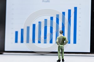 Businessmen stand and look at the graph Marketing Growth display