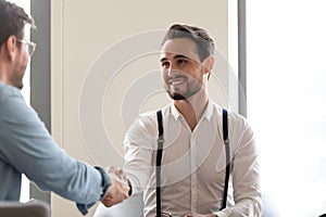 Businessmen start formal meeting shake hands express respect