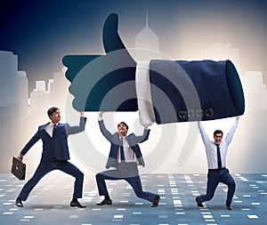 Businessmen supporting thumbs up gesture