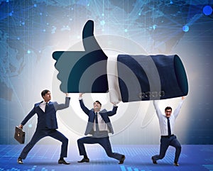 Businessmen supporting thumbs up gesture