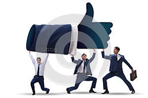 The businessmen supporting thumbs up gesture