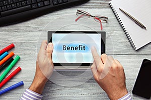 Businessmen using touchpad. Pressing Benefit button.