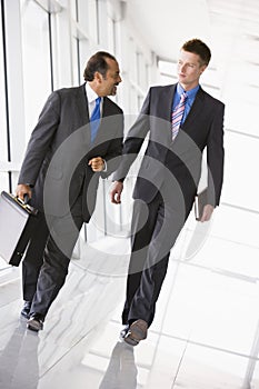 Businessmen walking through lobby