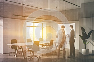 Businessmen in white meeting room