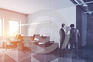 Businessmen in white office corner