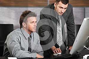 Businessmen working with computer