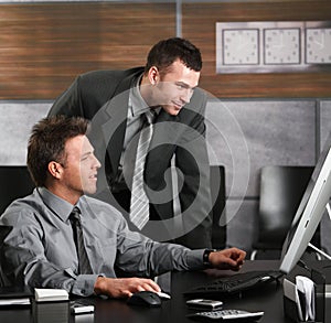 Businessmen working with computer