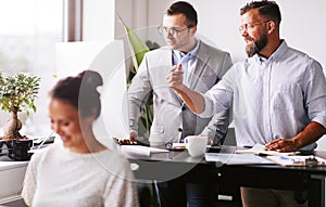 Businessmen working on a computer