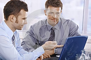 Businessmen working on laptop