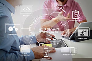 Businessmen working together on a document and using smart phone