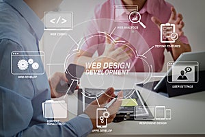 Businessmen working together on a document and using smart phone