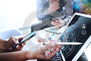 Businessmen working together on a document and using smart phone