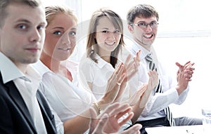 Businesspeople applauding during a meeting