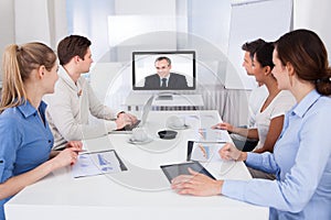 Businesspeople attending video conference