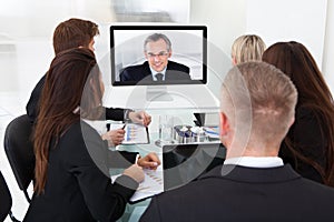 Businesspeople attending video conference