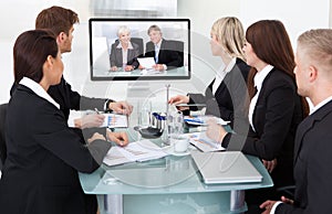 Businesspeople attending video conference