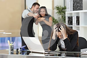 Businesspeople bullying a colleague at office