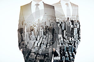 Businesspeople on city background multiexposure