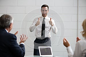 businesspeople clapping hands during a meeting