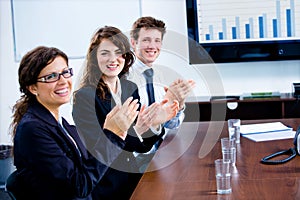 Businesspeople clapping on training