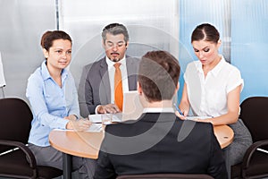 Businesspeople conducting interview