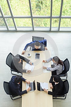 Businesspeople in conference room at office.