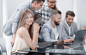 Businesspeople with digital computer having meeting In office