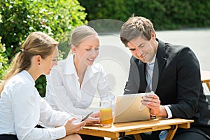 Businesspeople With Digital Tablet And Mobile Phone