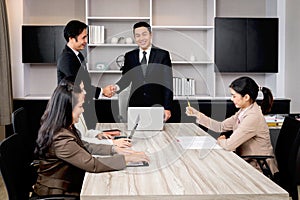 Businesspeople discussing at conference office desk, manager leader shaking hands at group board meeting. businessman reached