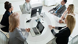 Businesspeople discussing together in conference room during meeting at office